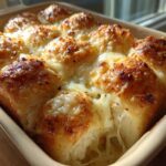 Close-up of freshly baked Garlic Parmesan Pull-Apart Bread with golden crust and melted, gooey cheese.