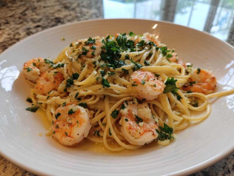 Close-up of Garlic Butter Shrimp Pasta with Lemon Flavor, featuring linguine tossed in butter sauce with plump shrimp and fresh parsley.